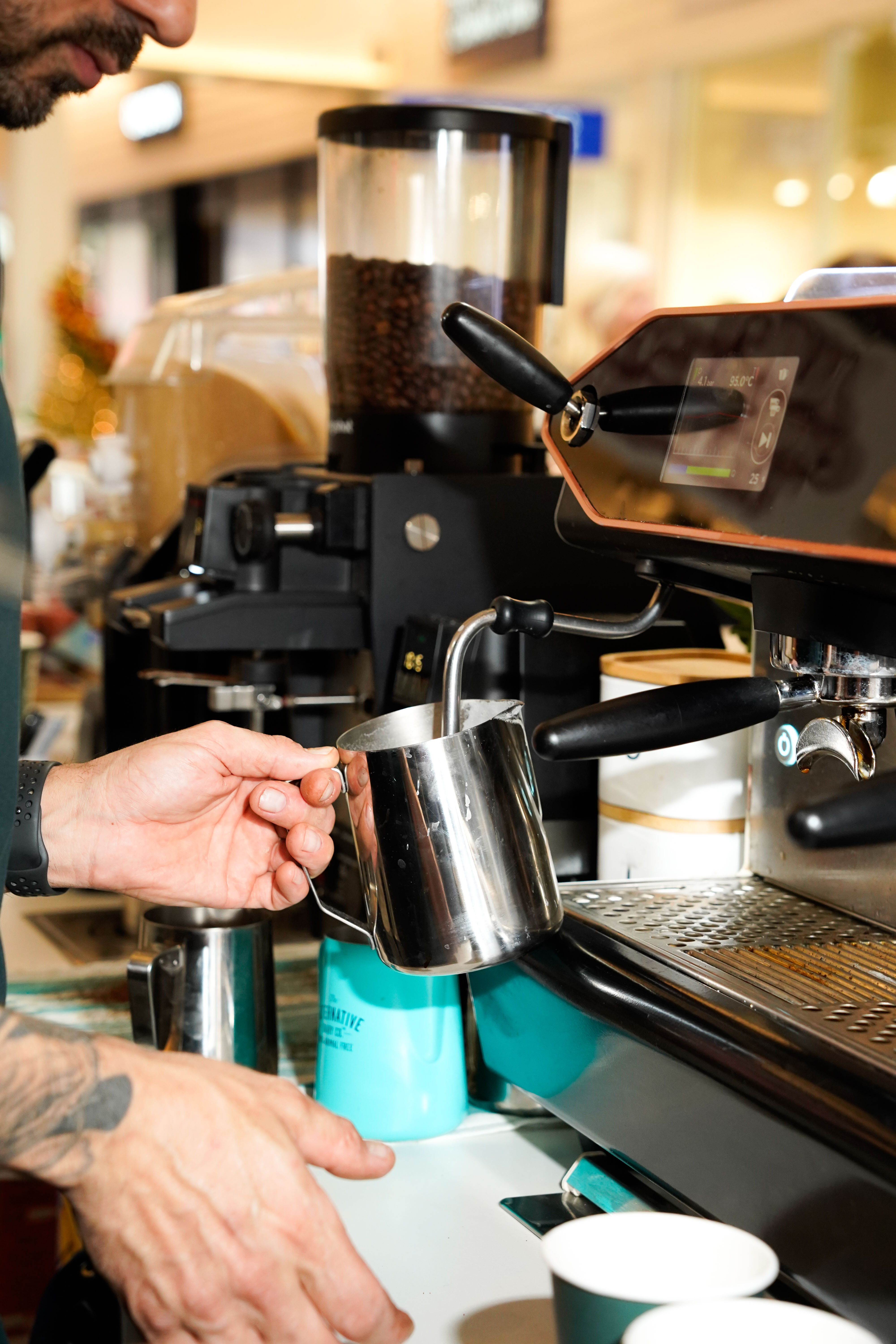 Barista steaming milk